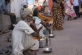 Line of Beggars Sitting Outside a Temple in India